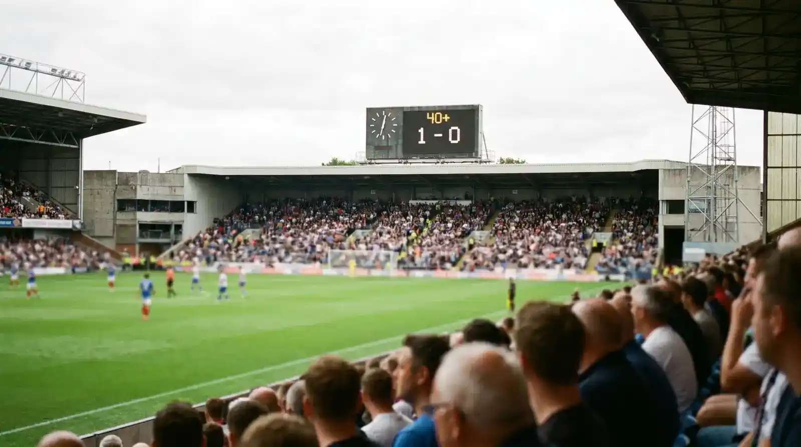 Football stadium clock display showing the first half ticking past forty minutes with the match score visible in the corner