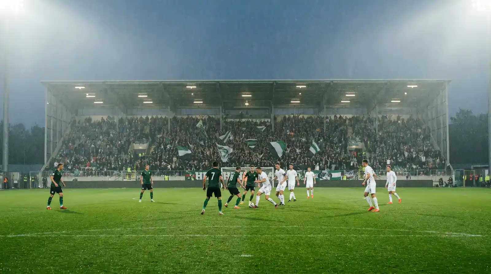 Conference League knockout play-off second leg between a German club and a Greek opponent under floodlights