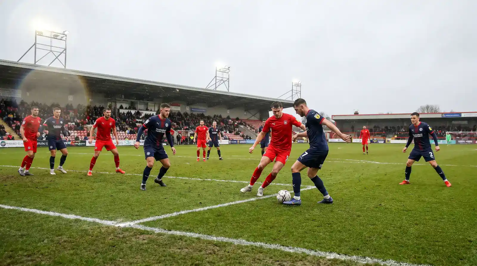 EFL League One football match in progress with action around the penalty area